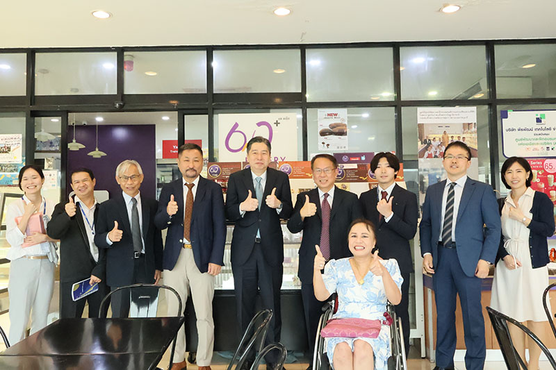 The delegation explored the APCD projects and took a group photo with APCD staff at APCD 60+ Plus Bakery & Chocolate Café.