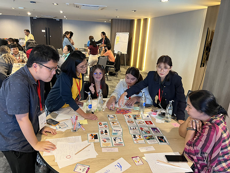 Participants play board games, to learn and enjoy. After activities they provide feedback for improvement.