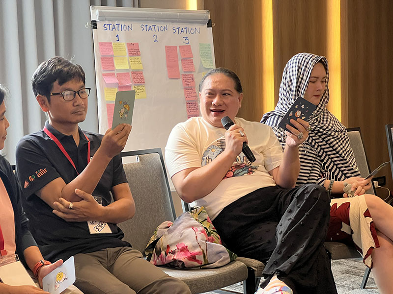 Participants play board games, to learn and enjoy. After activities they provide feedback for improvement.
